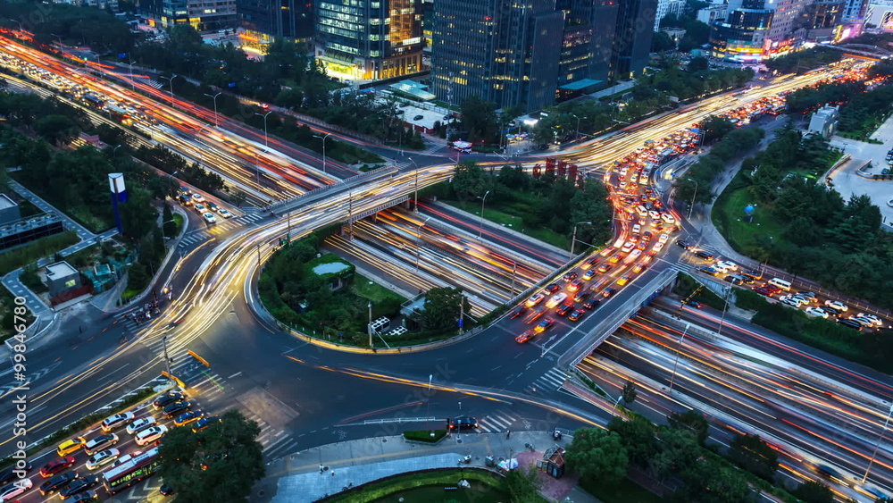 Timelapse of driving & cars racing by with streaking lights trail at night. Timelapse of driving & cars racing by with streaking lights trail at night.