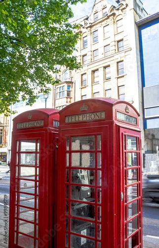 Two traditional old red telephon booth in the central London