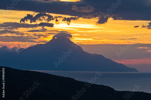 Greek coast of aegean sea at sunrise near holy mountain Athos