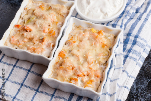 fish gratin with cream, cheese and pumpkin. French dish julienne