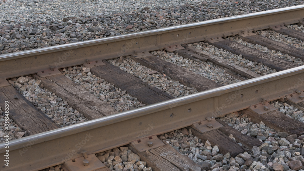 Steel railroad tracks, ties and spikes sitting on a gravel bed ready for the morning train. Steel railroad tracks, ties and spikes sitting on a gravel bed ready for the morning train.