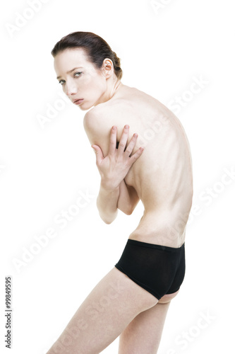 Foto Young woman suffering from anorexia isolated on white background