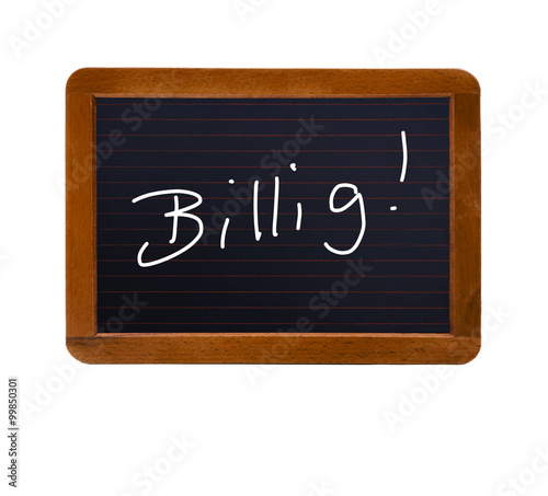 Schreibtisch von oben mit "Billig" Text