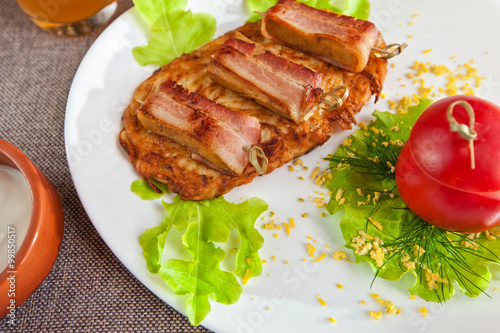 veal meat with bacon