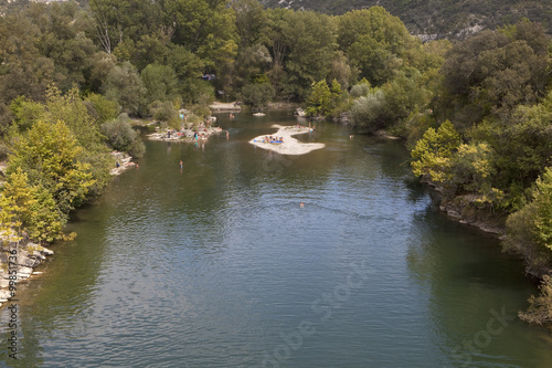A Swimming Hole in the River L'Herault. The river L'Herault is a beautiful meandering river in the south of France. In summer its many swimming holes are visted by people on their summer holidays.