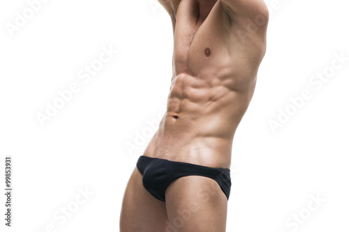 Принти на полотні Handsome muscular bodybuilder posing on white background