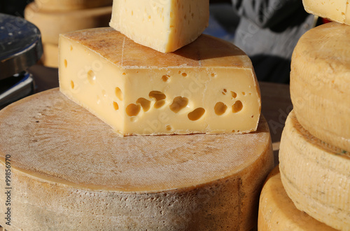 mature cheese with holes for sale in the market