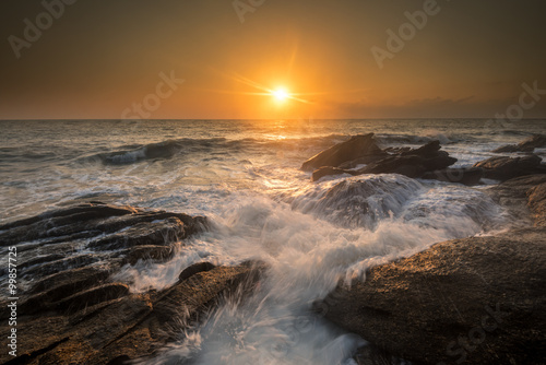 sea waves lash line impact rock on the beach