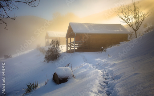 Log cabin on winter morning