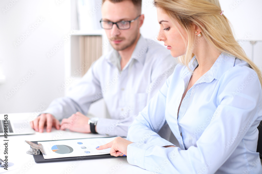 Two successful business partners working at meeting in office Two successful business partners working at meeting in office