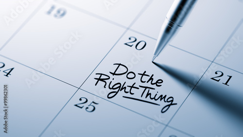 Foto Closeup of a personal agenda setting an important date written w