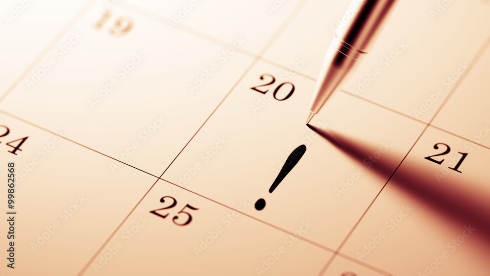 Closeup of a personal agenda setting an important date written w Closeup of a personal agenda setting an important date written w