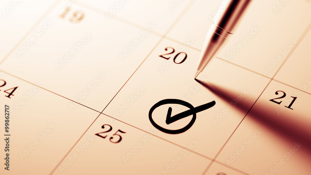 Closeup of a personal agenda setting an important date written w Closeup of a personal agenda setting an important date written w