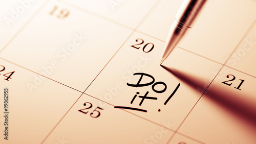 Fotografie Closeup of a personal agenda setting an important date written w