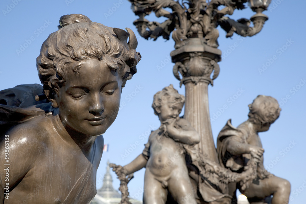 Figures on Alexandre III Bridge, Paris with the Grand Palais in the Background