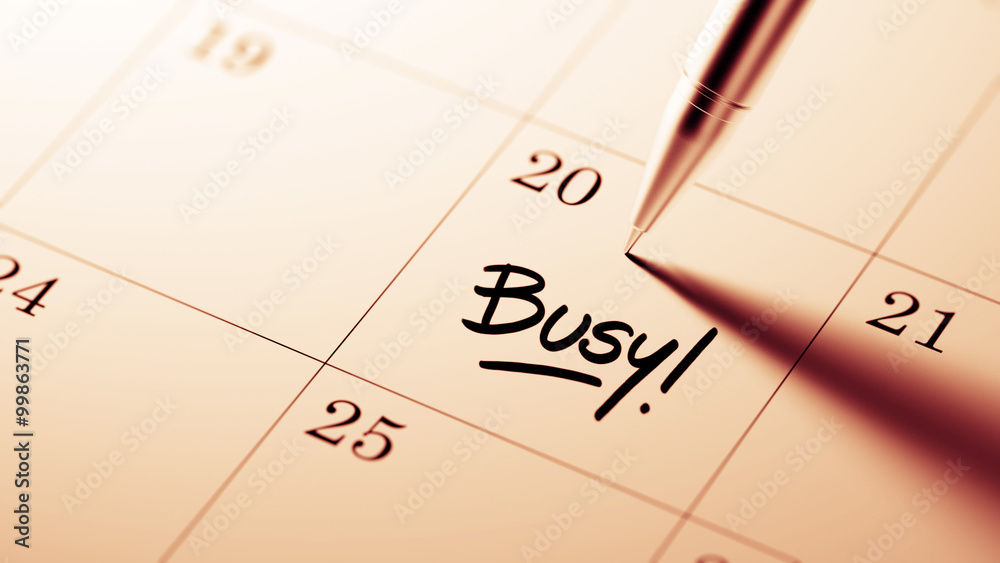 Closeup of a personal agenda setting an important date written w Closeup of a personal agenda setting an important date written w