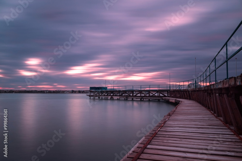 Sunset over the fishing pier of bulgarian black sea coast