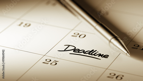 Closeup of a personal agenda setting an important date written w