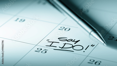 Closeup of a personal agenda setting an important date written w © xtock