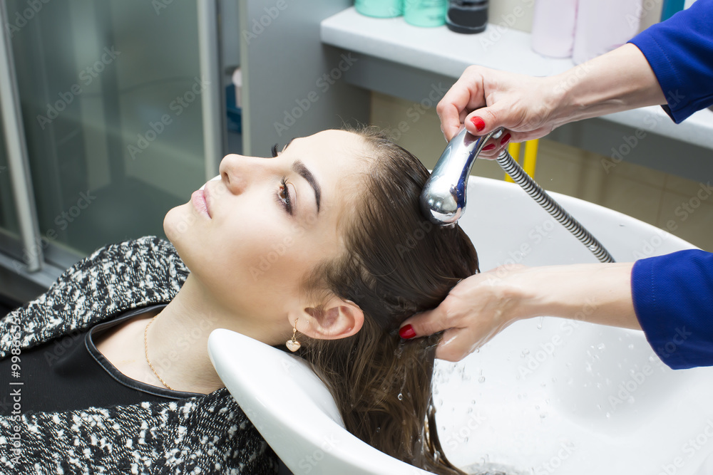 Fototapeta premium woman in a beauty salon doing hair