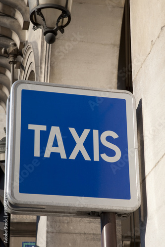 Blue Taxi Sign in Paris Street, France