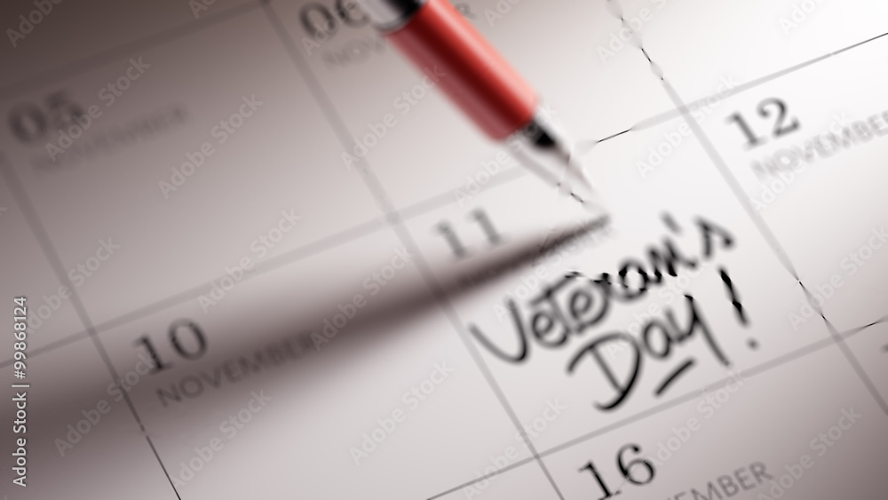 Closeup of a personal agenda setting an important date written w Closeup of a personal agenda setting an important date written w