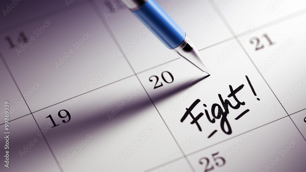 Closeup of a personal agenda setting an important date written w Closeup of a personal agenda setting an important date written w