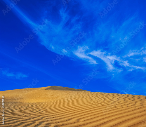 Desert sand nature landscape. Travel background with blue sky and sand dunes