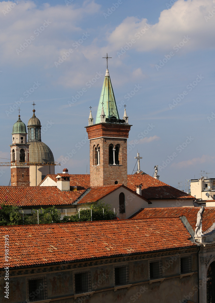 High bell towers and roofs and statue of the old town of Vicenza