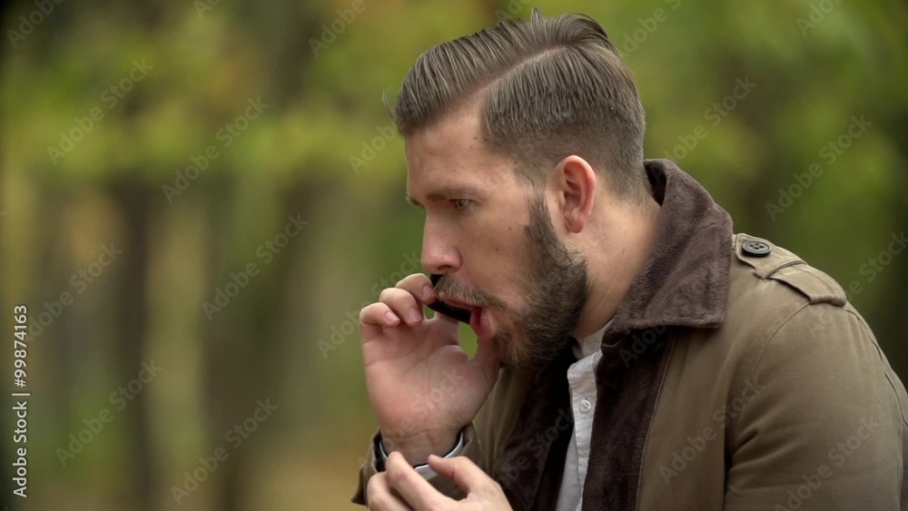 The Angry Man in Expressive Way Swears by Phone The Angry Man in Expressive Way Swears by Phone