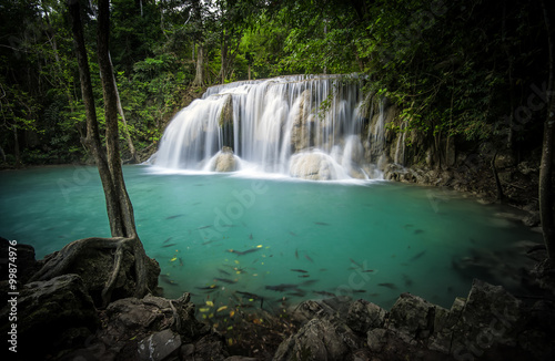 Clear water pond and silky waterfall in forest