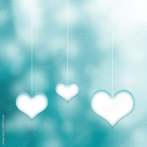 Lovely three white cyan hearts hang on thin white rope on blurred cyan bokeh background. Conceptual valentine day copy space illustration.