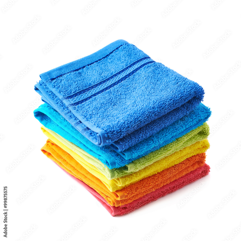Pile of rainbow colored towels isolated Pile of rainbow colored towels isolated