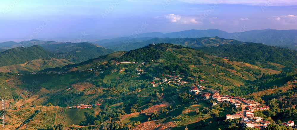 Chiang Rai rural sites with green hills at sunset. Travel panorama
