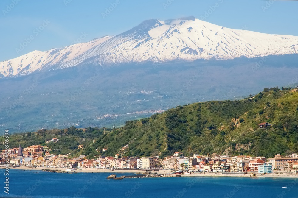 The bay of Giardini Naxos and volcano Etna from Taormina, Sicily, Italy