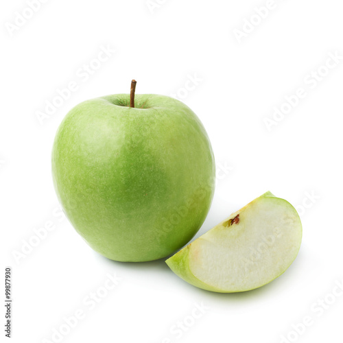 Green apple next to a slice isolated