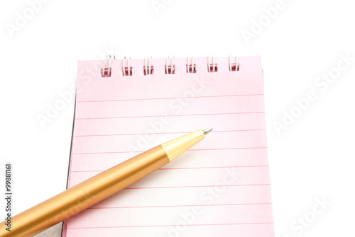 golden pen and pink notepad