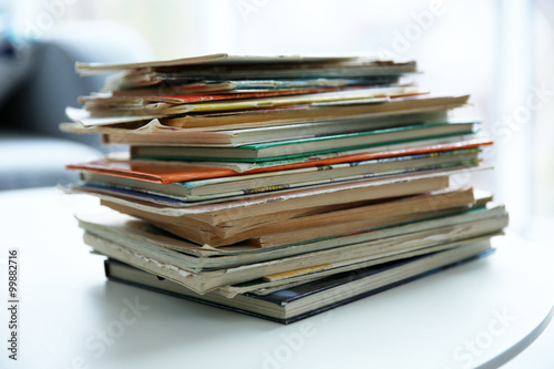 Pile of old books on white table