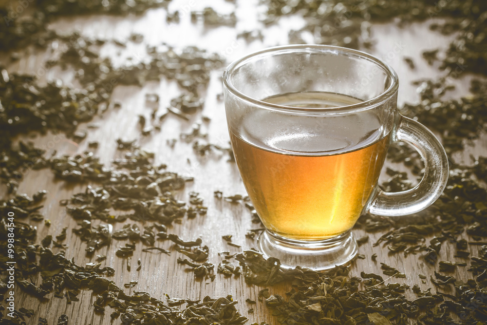 Green tea transparent cupon wooden table. Green tea transparent cupon wooden table.