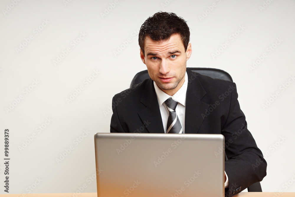Handsome businessman in suit works on the computer, left you can write some text
Handsome businessman in suit works on the computer, left you can write some text