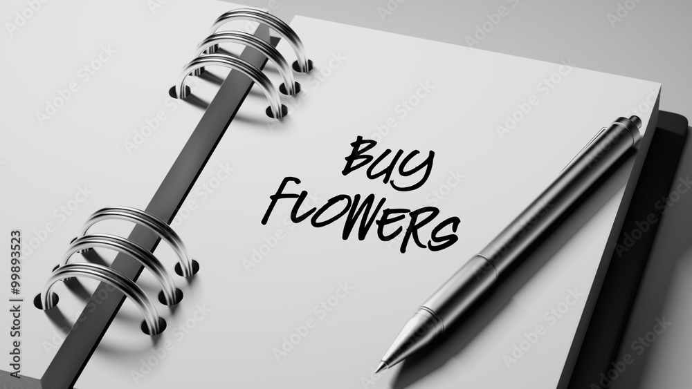 Closeup of a personal agenda setting an important date writing w Closeup of a personal agenda setting an important date writing w