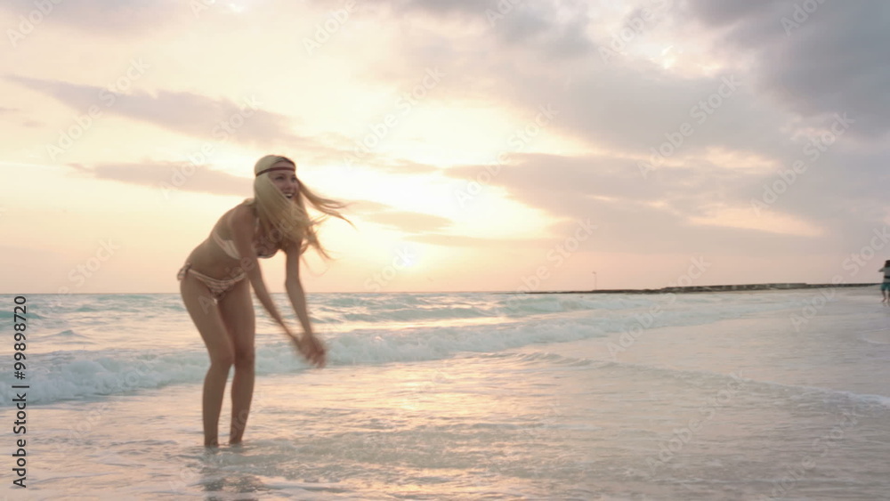 Woman plays with water on sea side gimbal steadicam Woman plays with water on sea side gimbal steadicam