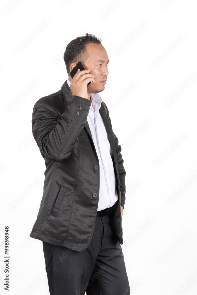 Businessmen are serious about the check stocks from a phone. Businessmen are serious about the check stocks from a phone.