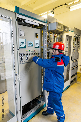 Electricians on high voltage substation