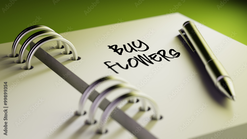 Closeup of a personal agenda setting an important date writing w Closeup of a personal agenda setting an important date writing w