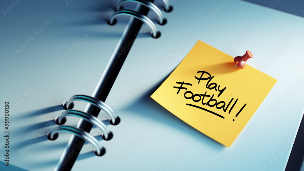 Obraz premium Closeup Yellow Sticky Note paste it in a notebook setting an app