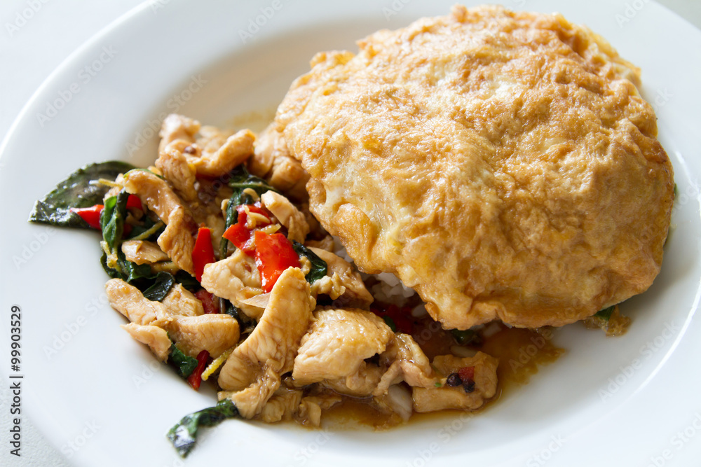 stir fried chicken with basil leaf and deep fried egg, asian str stir fried chicken with basil leaf and deep fried egg, asian str