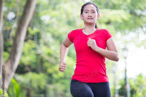 Young asian woman jogging at the park © Odua Images