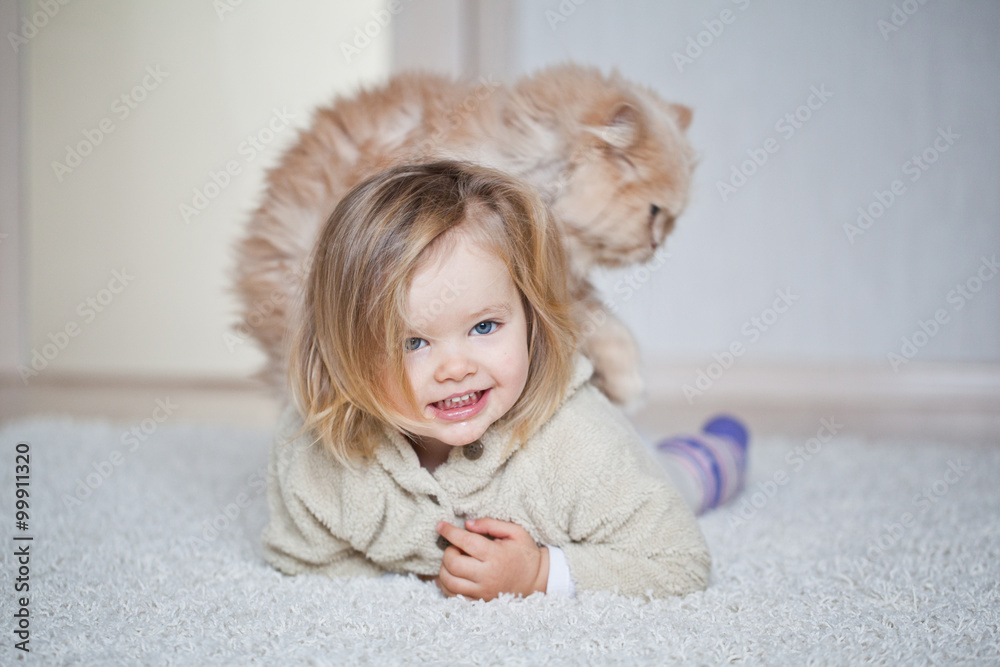 Little girl are playing with a cat Little girl are playing with a cat