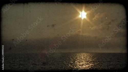 Sunset on the ocean 1. Vintage stylized video clip.